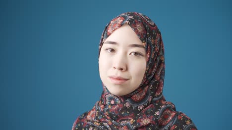 Innocent-and-beautiful-Muslim-Asian-woman-in-hijab-smiling.